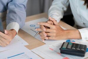 Financial Consultation and Analysis. Professionals discussing financial reports and data insights. photo