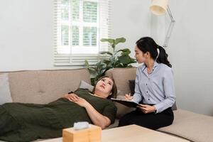 Therapy Session and Emotional Expression. A psychiatrist documenting a session with a patient sharing her feelings and thoughts. photo