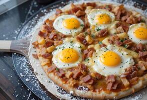 A pizza with eggs and bacon on top photo