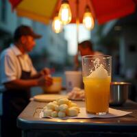Making Refreshing Orange Drink with Small Dough Balls at an Outdoor Stand photo