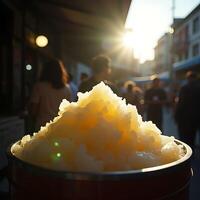 Shaved Ice Dessert in Container on Street at Sunset photo