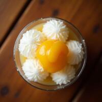 Serving Dessert with Fruit and Whipped Topping in Glass photo