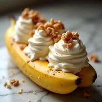 Preparing Banana Split with Cream and Nuts on a Marble Counter photo
