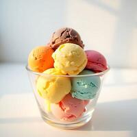 Colorful Ice Cream Scoops in Glass Bowl on White Surface photo