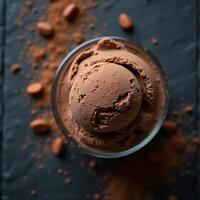 Chocolate Ice Cream Scoops in Glass with Cocoa Powder and Almonds photo