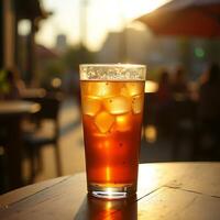Iced Tea Refreshment on Sunny Table Outside at Cafe photo