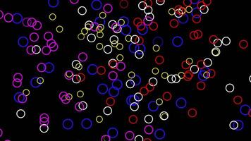 falling colorful circles on black background animation. rainbow circles bubbles. video