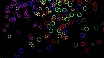 Spray colorful circles on black background animation. flying rainbow circles. video
