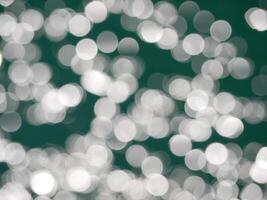 Water surface top view. Blurred defocus with bokeh effect. Sun glare on water. Background abstracted texture wallpaper photo