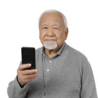 Elderly man with gray hair and beard holding smartphone, wearing gray sweater and shirt, looking at camera with neutral expression png
