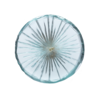 Round, clear glass object with starburst pattern radiating from center, creating textured and intricate design. glass has light blue tint, adding subtle color to otherwise transparent material png