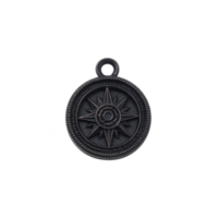 Round metal pendant with compass design, featuring loop for attachment. intricate detailing includes star pattern, giving it vintage and nautical feel png