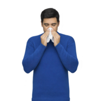 Man in blue sweater is blowing his nose into tissue, possibly due to cold or allergies. image conveys sense of discomfort and relief png