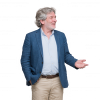 A smiling middle-aged man in a blue jacket stands confidently with one hand raised in a welcoming gesture, suggesting friendliness and approachability against a white background. png