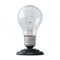 Classic incandescent light bulb on a black marble base, illuminated against a white isolated background. A symbol of innovation and creative inspiration. png