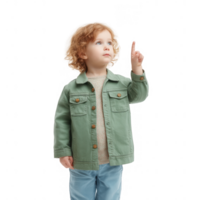 A curious child with curly hair pointing upwards, dressed in a stylish green jacket, captured against a white isolated background, exuding wonder and imagination. png