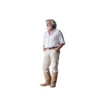 A mature man with long hair and a beard, wearing a white shirt, light-colored trousers, and boots. He stands confidently with hands in pockets against a white isolated background. png