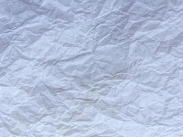 White recycled craft paper texture as background Grey paper texture. Old vintage page or grunge vignette of old newspaper. photo