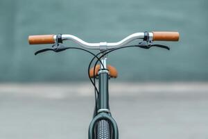 Vintage Green Bicycle with Orange Handlebars A Classic Ride for Urban Adventures photo