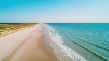 Serene Coastal Landscape Breathtaking View of Sandy Beach and Azure Ocean. Perfect for travel, vacation, and relaxation. Find your escape in this tranquil seaside paradise. photo