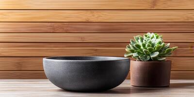 Dark Gray Bowl and Succulent Plant on Wooden Background. Simple, Elegant Home Decor, Minimalist Zen Style. Perfect for Interior Design Inspiration. photo