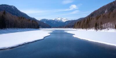 Majestic Winter Landscape Serene River Flows Through Snow Covered Valley, Surrounded by Alpine Mountains. A Breathtaking View of Nature's Beauty photo