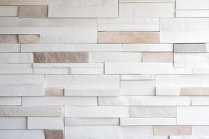 White Stone Wall Texture Modern Architecture Background. Beige and Grey Brickwork Pattern for Interior and Exterior Design, Home Decor, and Construction Projects. photo