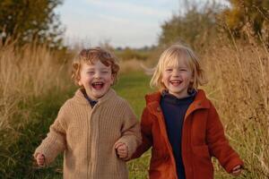 Two Happy Children Playing Outdoors in Autumn photo