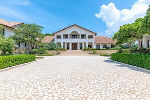 Stunning Luxury Mansion Exterior with Lush Landscaping photo