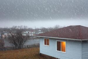 A house in the midst of a winter storm with heavy snowfall and flooded surroundings photo