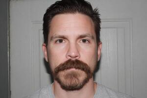 Portrait of a Man with a Well Groomed Mustache and Beard photo