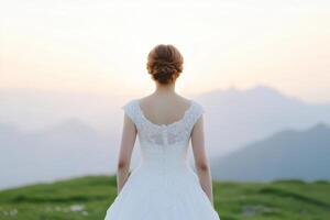 Bride's Majestic Back View in a Stunning Mountain Landscape photo