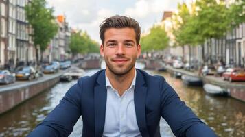 Confident Man Posing by Amsterdam Canal photo
