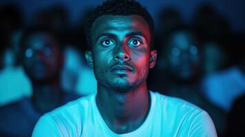 Intrigued Theatergoer Absorbed in the Cinematic Experience photo