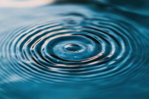 Water Ripples A Captivating Macro Photography of Water Droplet Impact photo