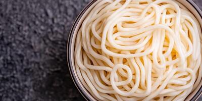 Aromatic Udon Noodles A Culinary Journey to Japan. Discover the taste and art of this classic Japanese dish. Experience the perfec photo