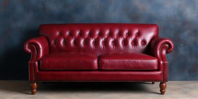A luxurious crimson leather sofa with button tufting, adding a touch of vintage elegance to any modern interior. Perfect for creat photo