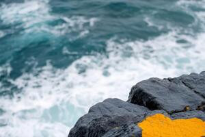 Majestic Coastal Cliffside Where the Ocean's Fury Meets the Unwavering Rock. A breathtaking landscape photography capturing the ra photo