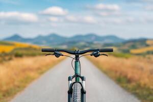 Cycling on a scenic road An adventurous journey through nature. Explore the mountains and valleys on two wheels. Feel the freedom photo