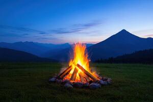 Majestic Mountain Bonfire at Night A Captivating Landscape Photography. The fiery glow of the campfire contrasts beautifully with photo