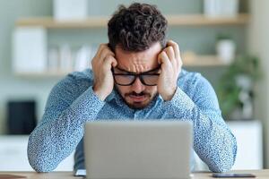 Overwhelmed and Stressed A Man Struggles with Work Challenges. A poignant image depicting the pressures of modern life, showcasin photo