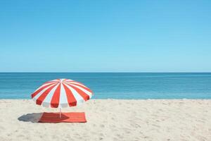 Red and White Striped Beach Umbrella on Sandy Shore Summer Vacation Serenity photo