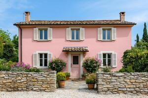 Charming Pink House with Stone Wall and Lush Garden Discover the idyllic beauty of this Italian countryside villa, perfect for a r photo