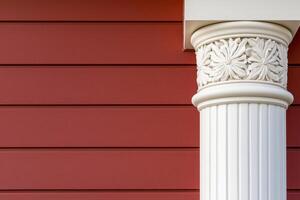 Classical Column Detail White Fluted Pillar Against Red Siding. Architectural Photography, Home Exterior Design, Classic Decor, Vi photo