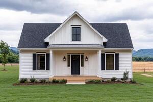 Modern Farmhouse Exterior White House with Black Accents, Landscaping, and Countryside Views. A stunning example of modern farmhou photo