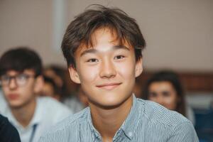 Portrait of a Smiling Teenager A Image of a Young Man's Face, Showing His Pleasant Expression and Calm Demeanor. The Photograph C photo