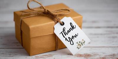 A heartfelt thank you gift, elegantly presented in a rustic brown kraft box with a delicate floral tag. Perfect for expressing gra photo