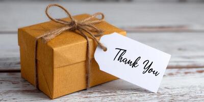 A heartfelt thank you gift, beautifully presented in a rustic brown box with a handwritten tag. A token of appreciation, perfect f photo