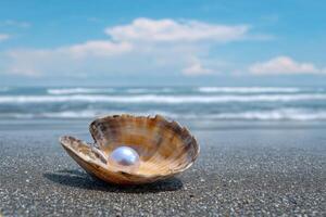 A glistening pearl nestled in a seashell on a tranquil beach, with the ocean waves gently lapping the shore under a vibrant blue s photo