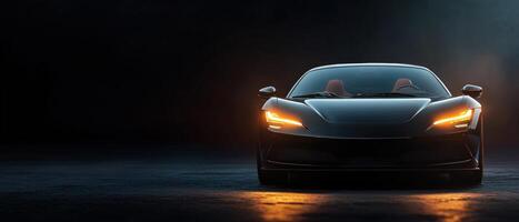 Black sports car glows on dark wet road in showroom. Automotive industry photo